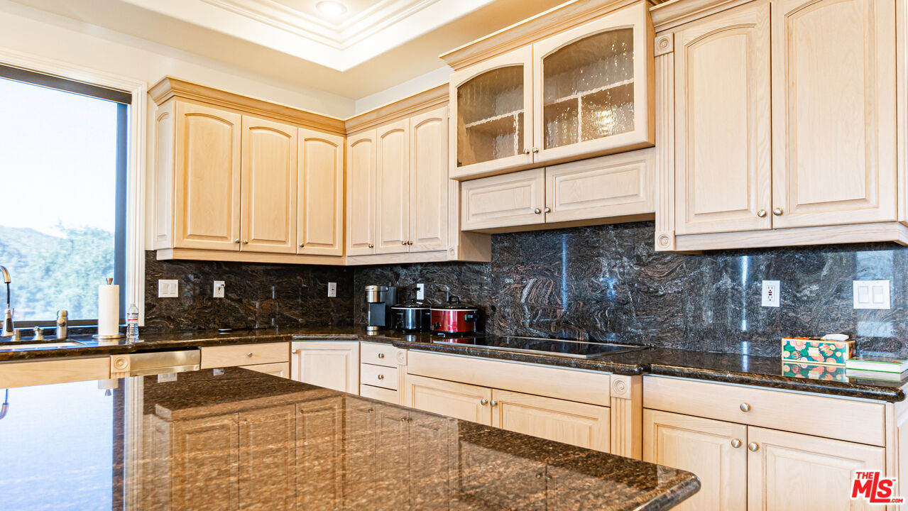 8321 Overview Court Yucaipa, CA 92399 - Photo 22 of 75 a kitchen with stainless steel appliances granite countertop a stove a sink and dishwasher with cabinets