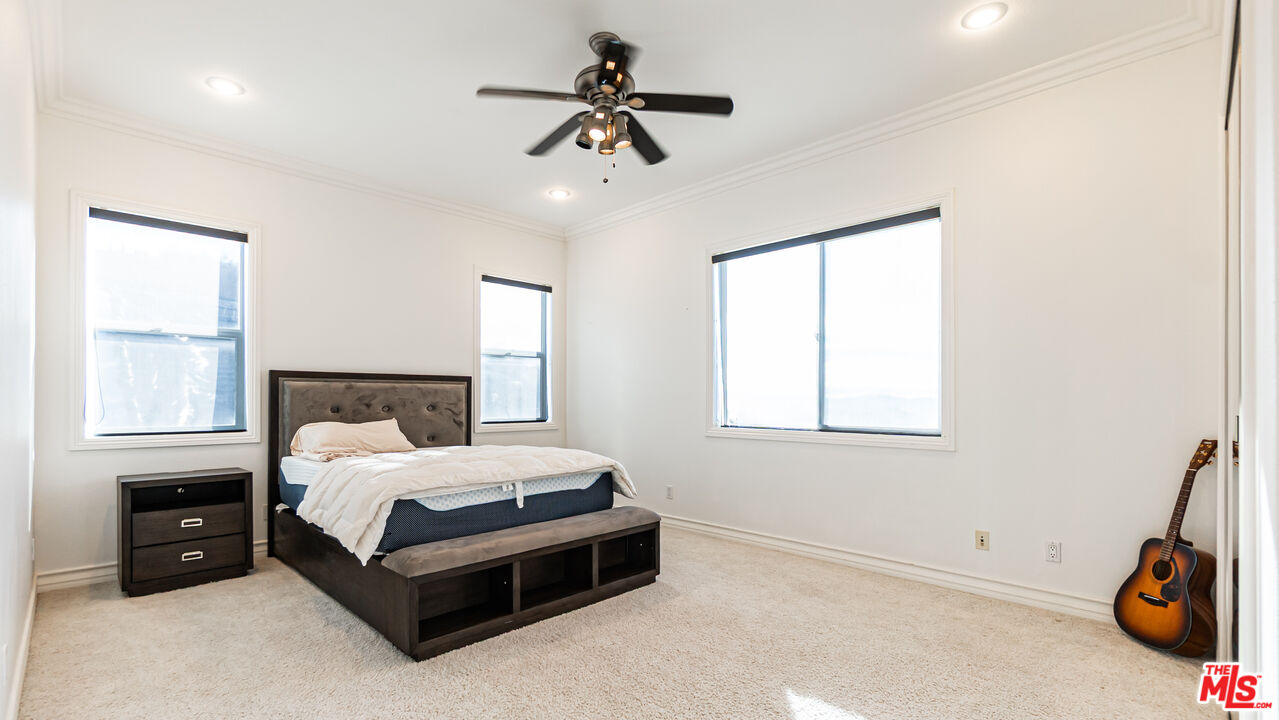 8321 Overview Court Yucaipa, CA 92399 - Photo 24 of 75 a bedroom with a bed and a window