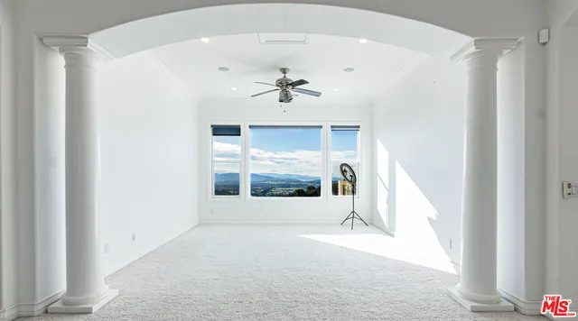 a living room with furniture window and a fireplace