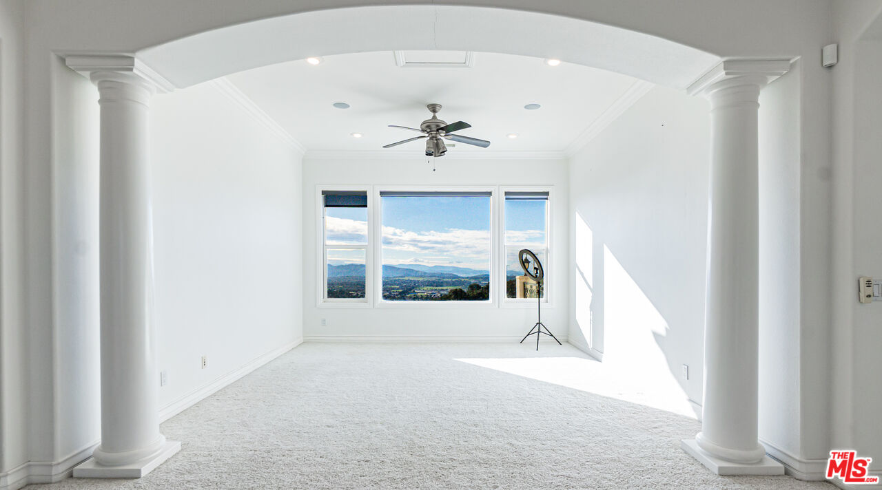 8321 Overview Court Yucaipa, CA 92399 - Photo 30 of 75 a view of n empty room with a fireplace