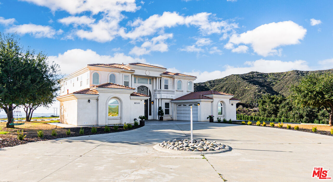 8321 Overview Court Yucaipa, CA 92399 - Photo 3 of 75 a front view of a house with a yard