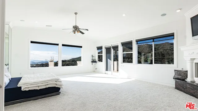 a large kitchen with cabinets a sink and dishwasher