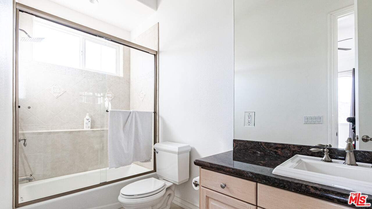 8321 Overview Court Yucaipa, CA 92399 - Photo 53 of 75 a bathroom with a granite countertop sink toilet and shower