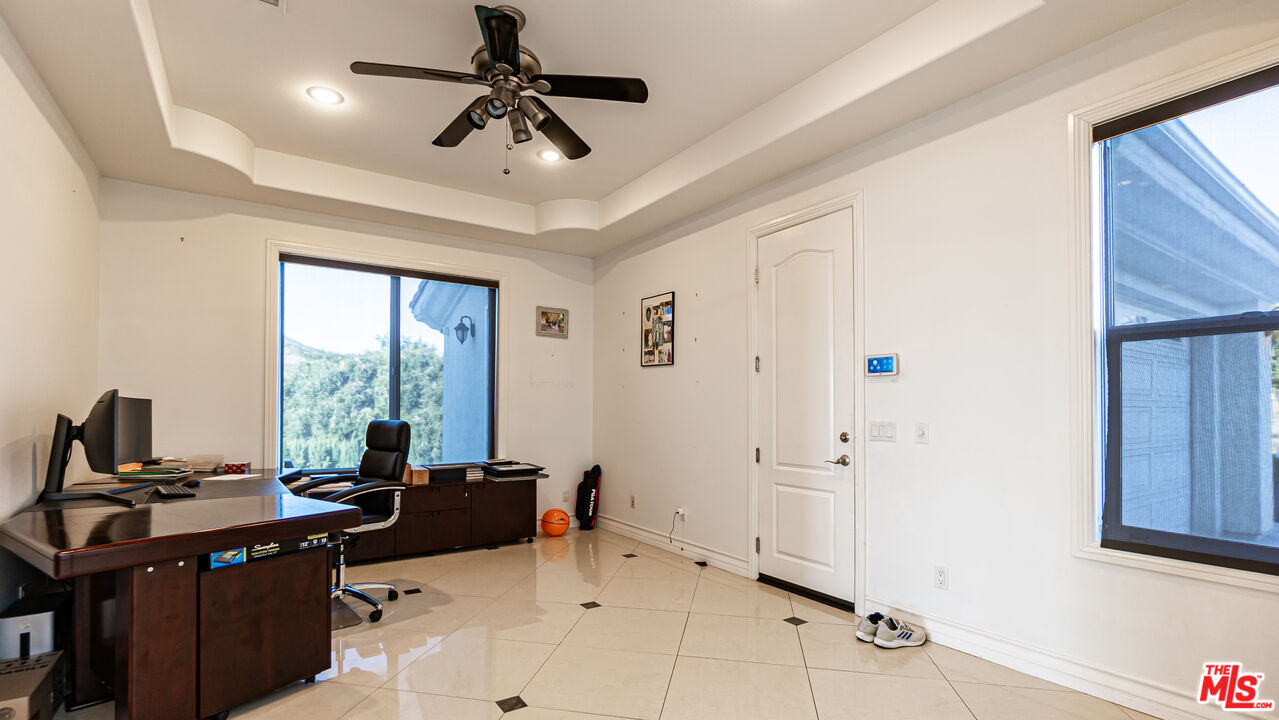8321 Overview Court Yucaipa, CA 92399 - Photo 7 of 75 a view of a workspace with furniture and a window