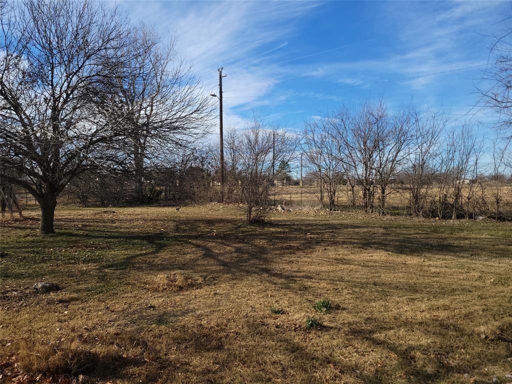 10936 Sam Reynolds Road Justin, TX 76247 - Photo 4 of 11 a view of dirt yard with large trees