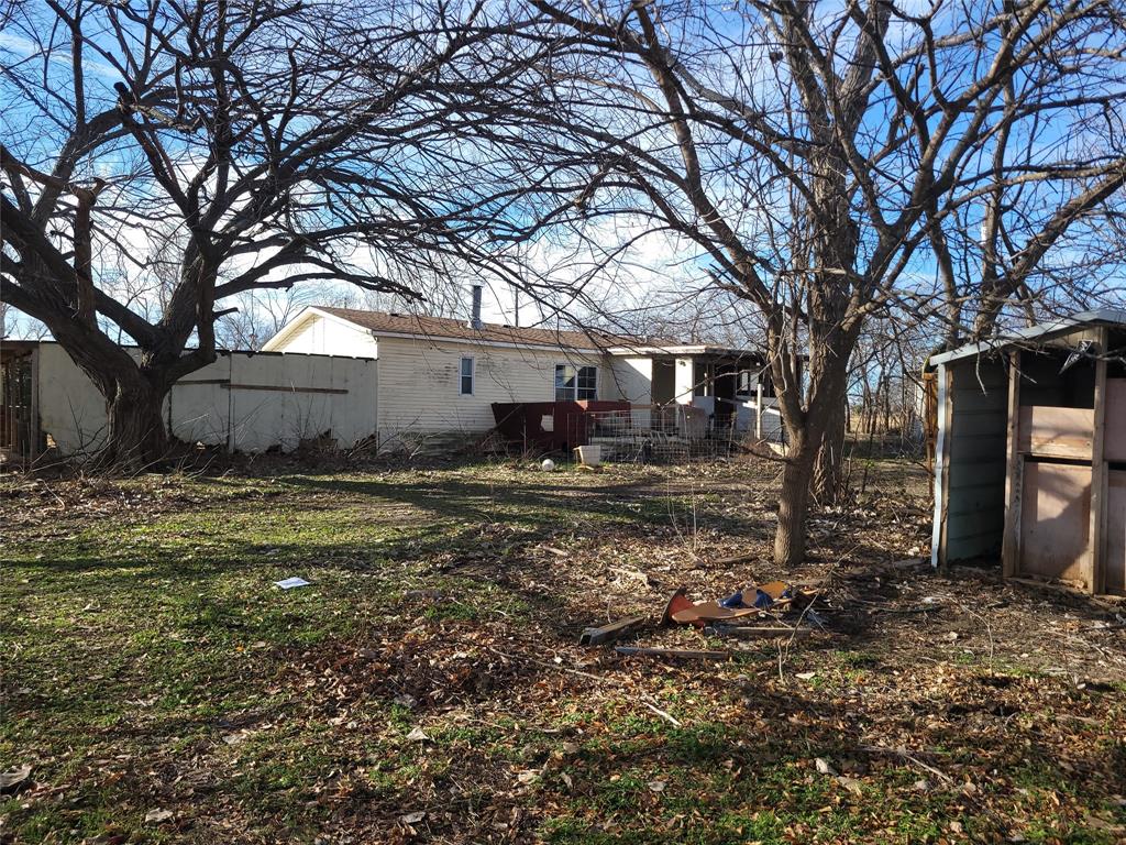 10936 Sam Reynolds Road Justin, TX 76247 - Photo 6 of 11 a backyard of a house with lots of green space