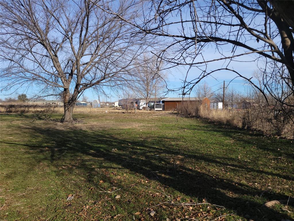 10936 Sam Reynolds Road Justin, TX 76247 - Photo 9 of 11 a view of a yard with large trees