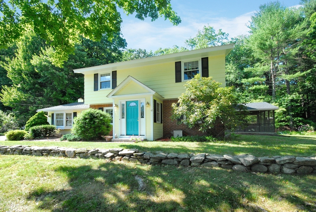 41 Clarissa Road Chelmsford, MA 01824 - Photo 1 of 26 a front view of a house with a yard