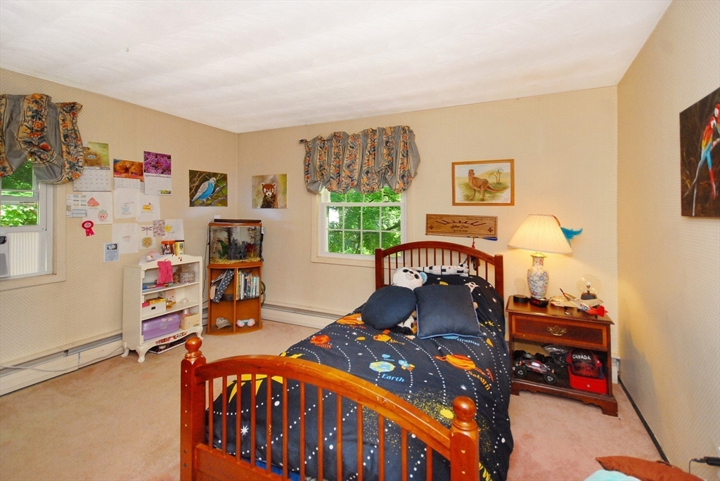 41 Clarissa Road Chelmsford, MA 01824 - Photo 19 of 26 a bedroom with furniture and a window