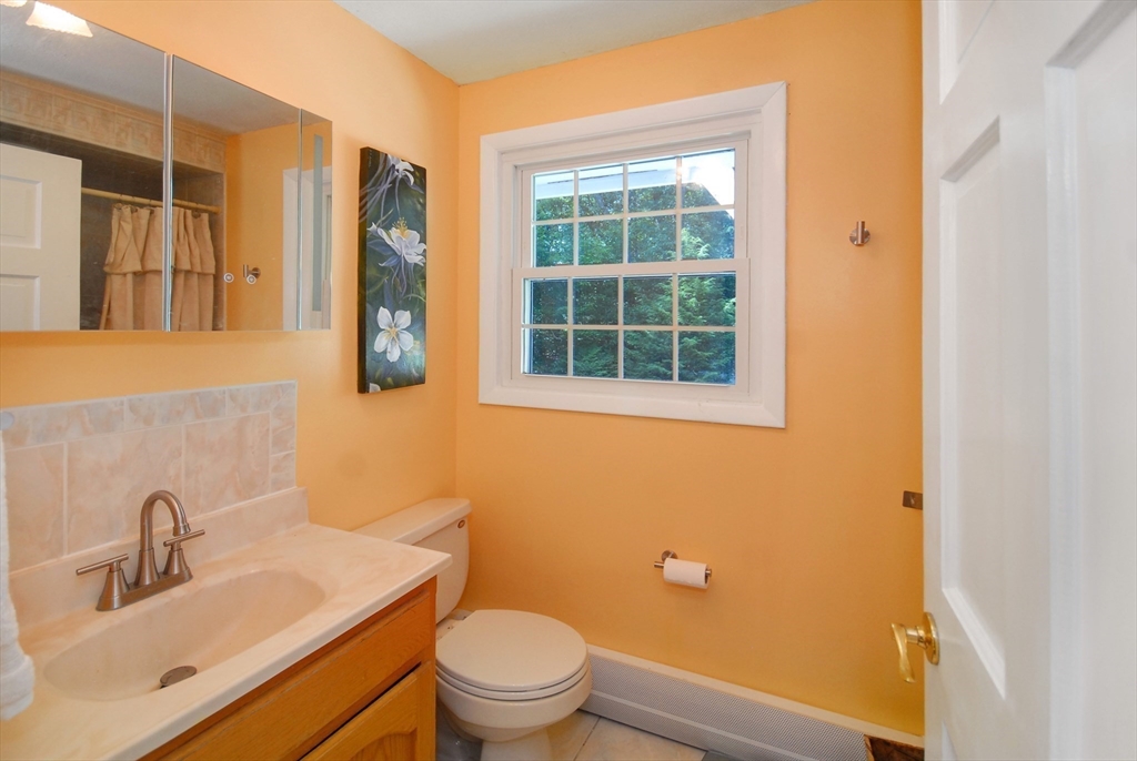 41 Clarissa Road Chelmsford, MA 01824 - Photo 20 of 26 a bathroom with a sink a toilet and shower