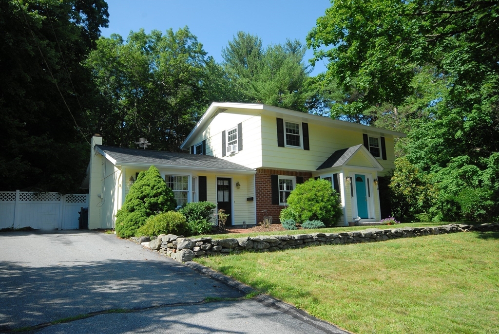 41 Clarissa Road Chelmsford, MA 01824 - Photo 2 of 26 a front view of a house with a yard