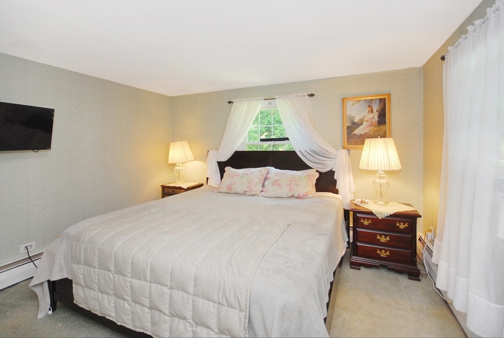 41 Clarissa Road Chelmsford, MA 01824 - Photo 21 of 26 a bedroom with a bed and a window