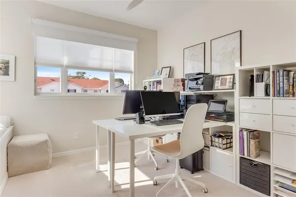 a view of a workspace with furniture