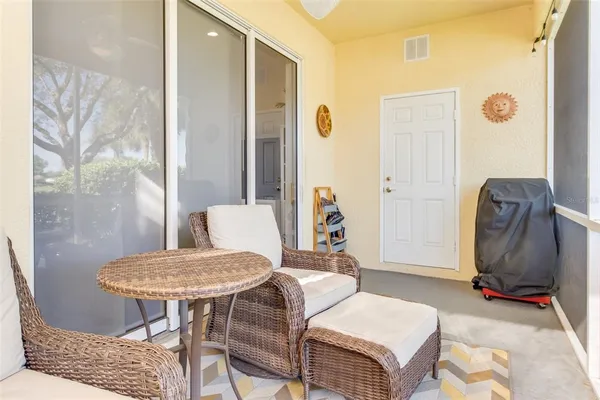 a living room with furniture and a chair