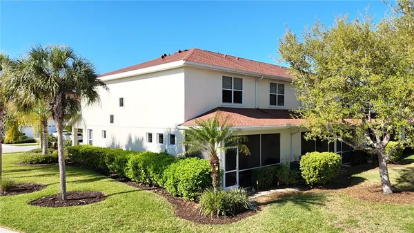 a view of a house with a yard and plants