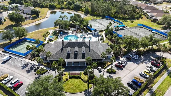 an aerial view of multiple houses with yard