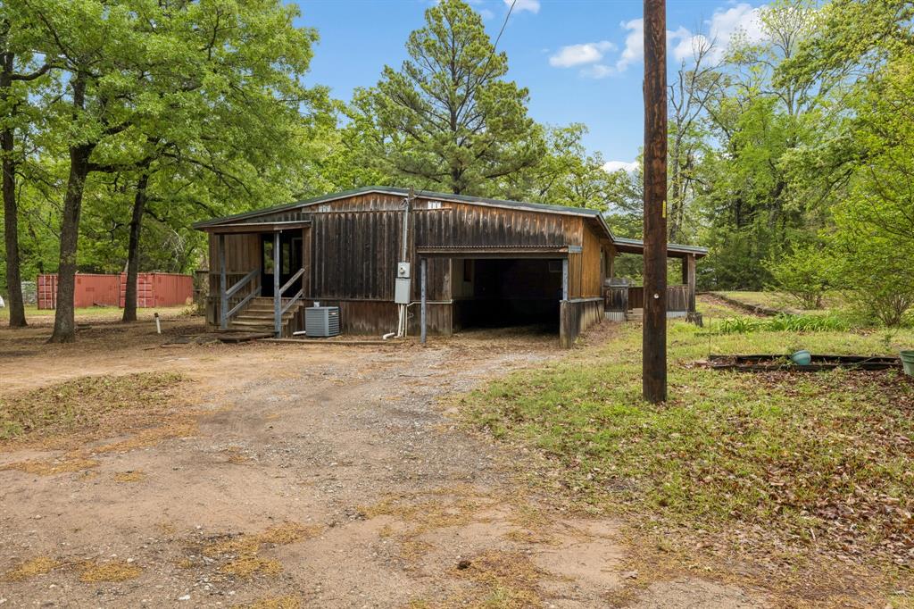 671 VZ County Road Canton, TX 75103 - Photo 22 of 33 Side of House with carport