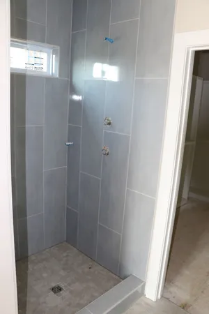 an empty room with a bathroom
