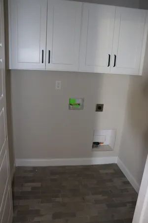 a kitchen with stainless steel appliances kitchen island a table chairs in it and granite countertops