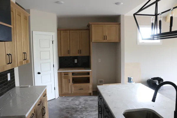 a living room with stainless steel appliances kitchen island granite countertop furniture and a kitchen view