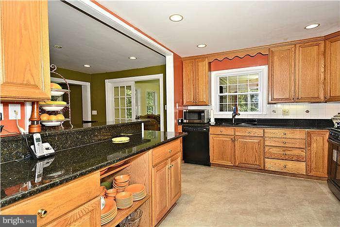 9908 Vale Road Vienna, VA 22181 - Photo 3 of 30 Kitchen w/new gas stove and granite