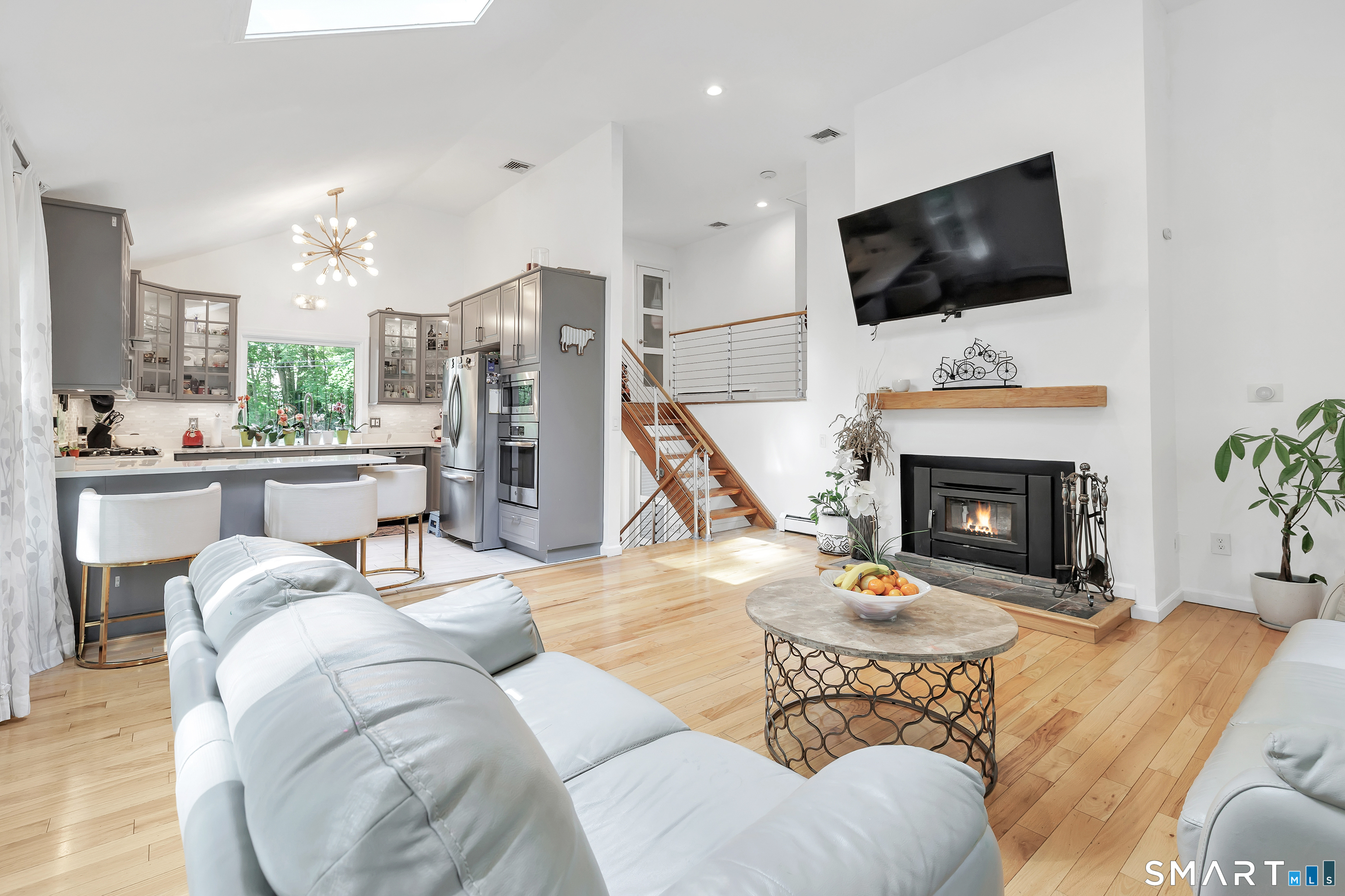 110 Bart Road Monroe, CT 06468 - Photo 3 of 35 Spacious, light drenched Living room featuring a Skylight, and wood burning stove.