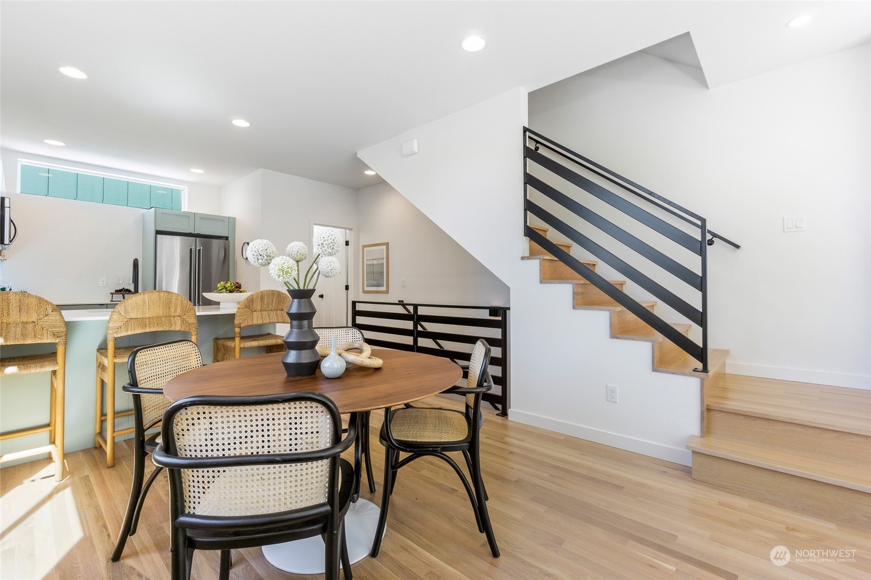 2620 Northwest 62nd Street, Unit B Seattle, WA 98107 - Photo 11 of 34 a dining room with furniture and wooden floor
