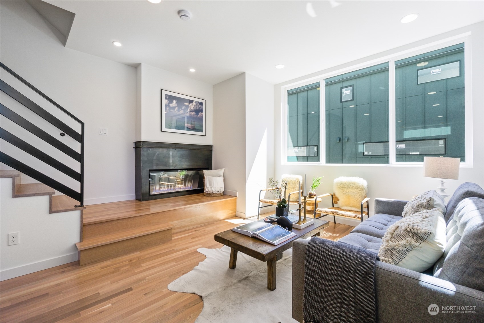 2620 Northwest 62nd Street, Unit B Seattle, WA 98107 - Photo 12 of 34 a living room with furniture and a fireplace