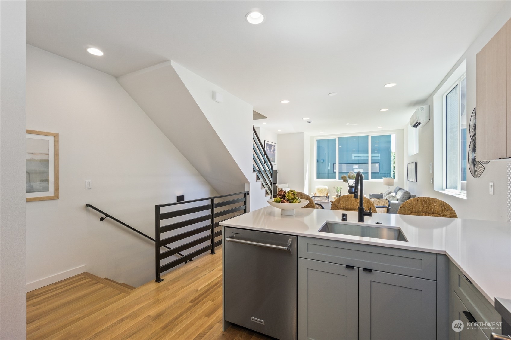 2620 Northwest 62nd Street, Unit B Seattle, WA 98107 - Photo 23 of 34 a room with two sink and wooden floor