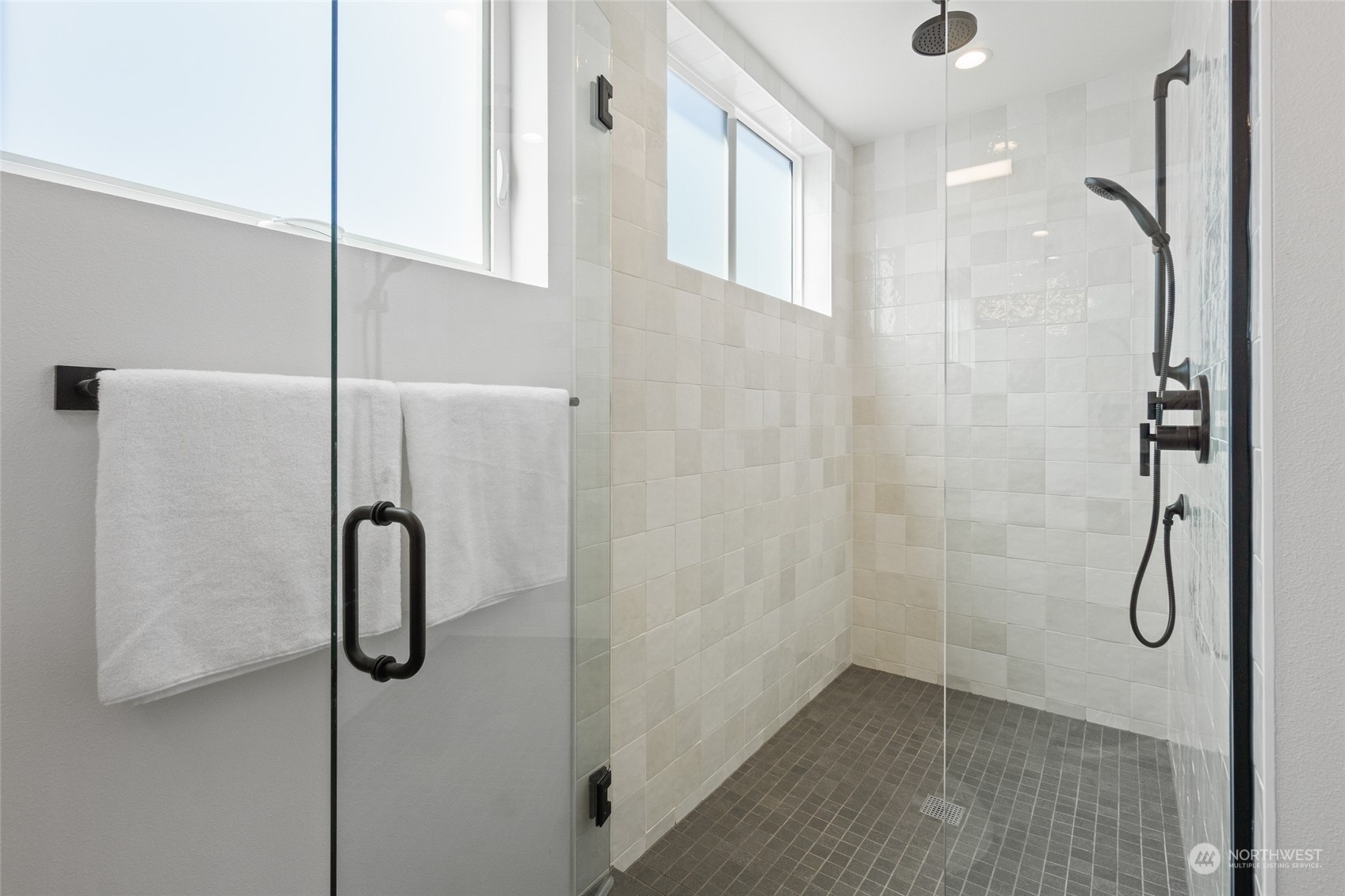 2620 Northwest 62nd Street, Unit B Seattle, WA 98107 - Photo 27 of 34 a bathroom with a shower