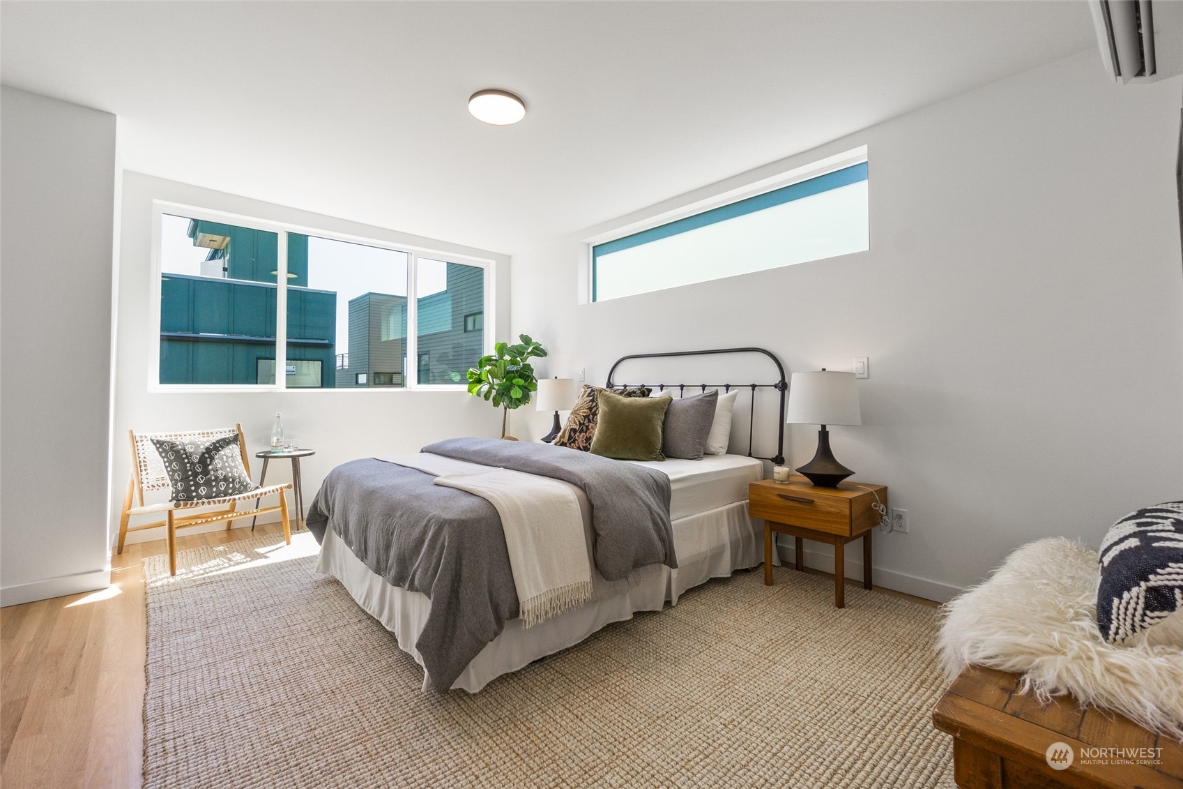 2620 Northwest 62nd Street, Unit B Seattle, WA 98107 - Photo 28 of 34 a spacious bedroom with a bed and a window