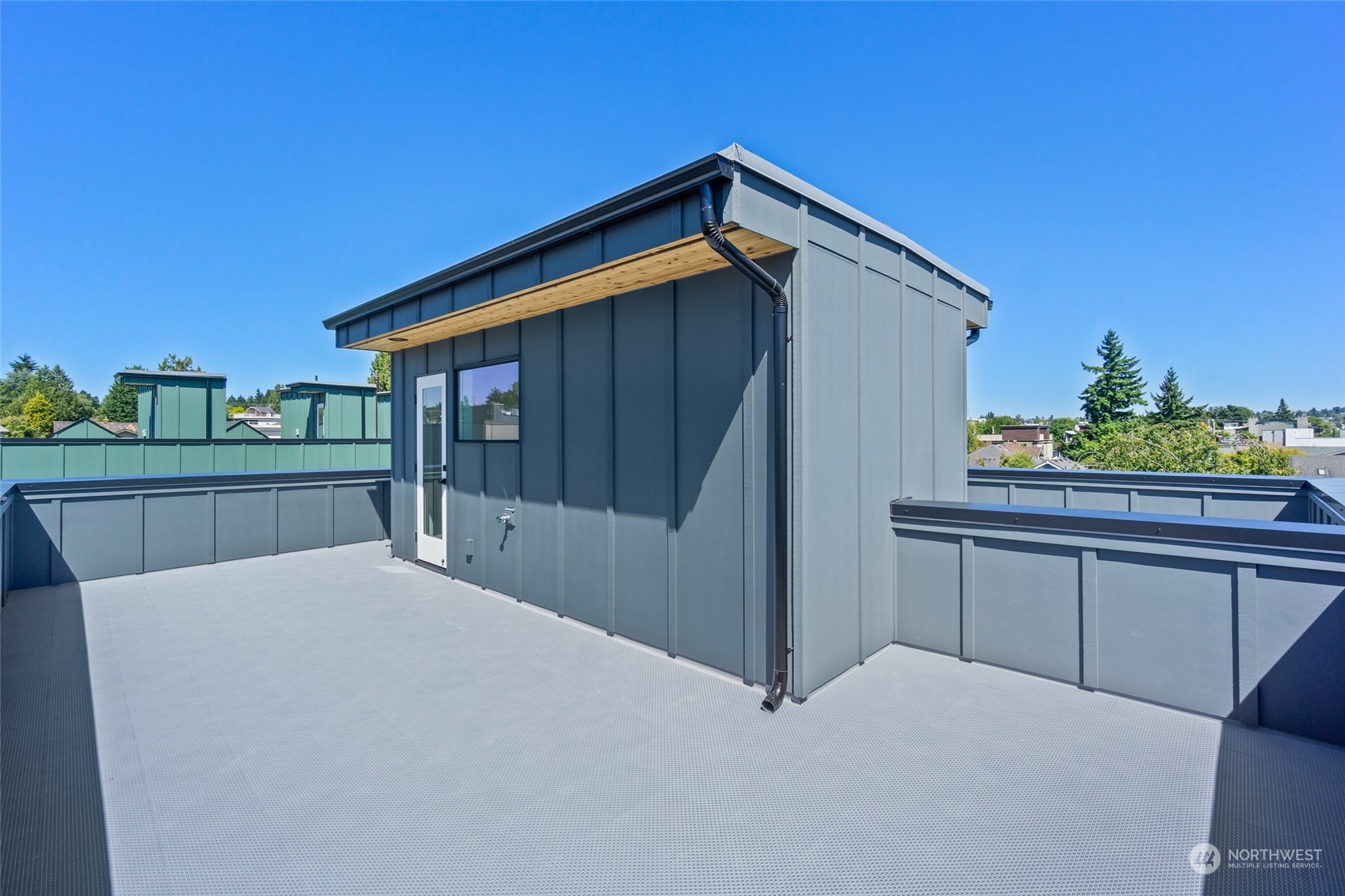 2620 Northwest 62nd Street, Unit B Seattle, WA 98107 - Photo 32 of 34 a view of backyard with deck and outdoor seating