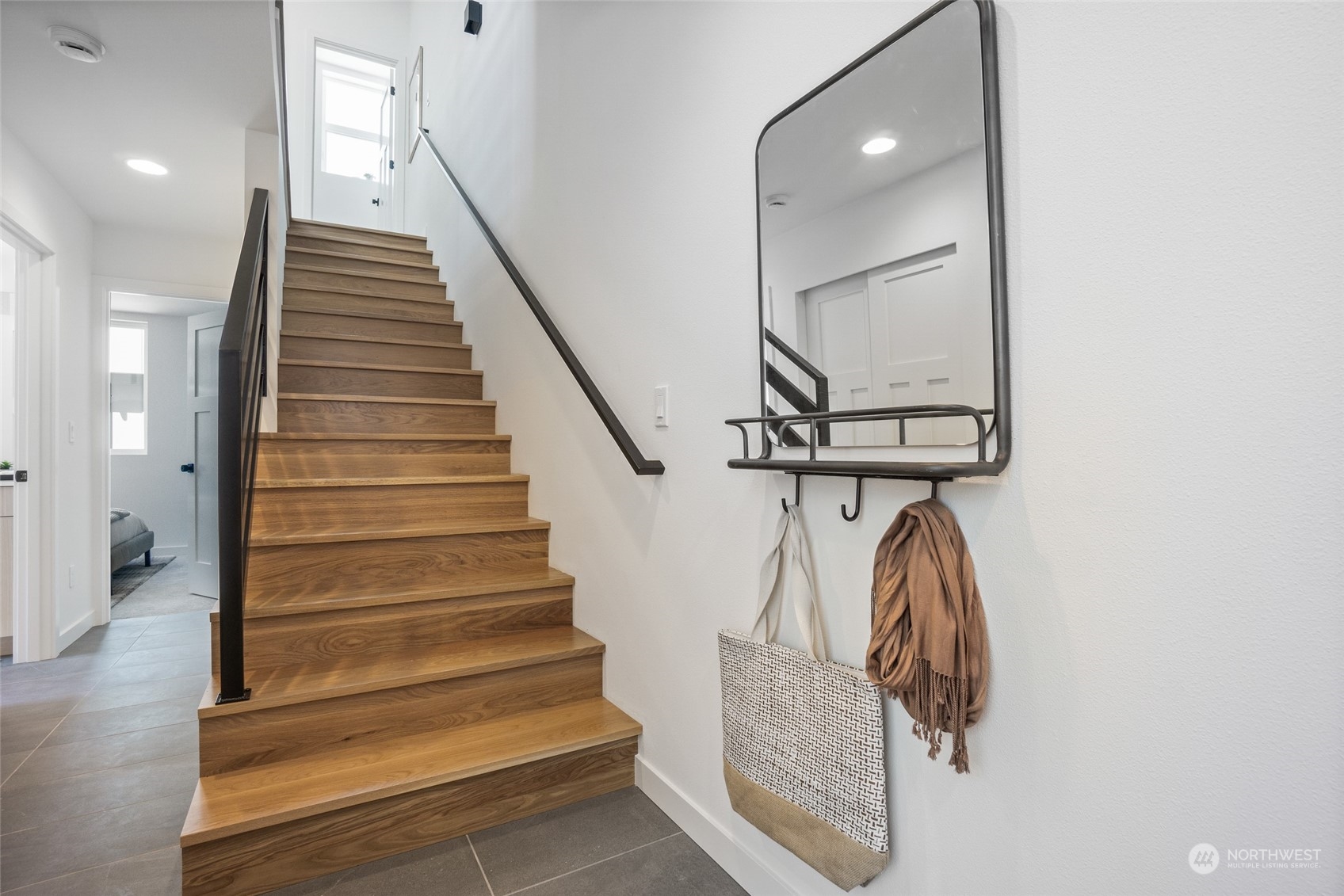 2620 Northwest 62nd Street, Unit B Seattle, WA 98107 - Photo 4 of 34 a view of entryway and hall with wooden floor