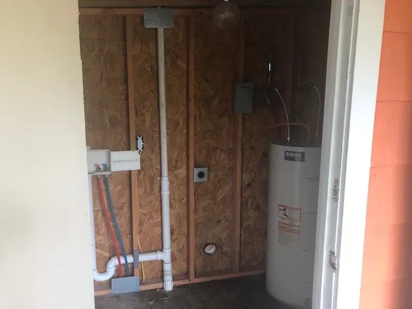 a bathroom with a shower and a glass door