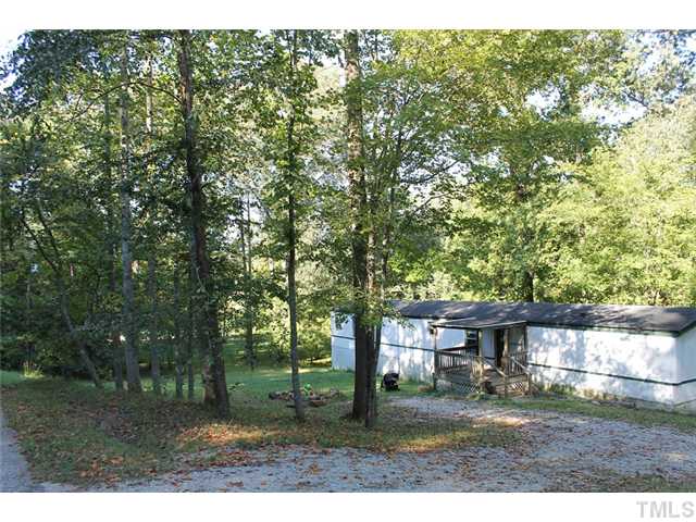 120 Canyon Road Clayton, NC 27520 - Photo 2 of 8 1990 Single Wide Mobile Home measuring 14x72 on 6.93 acre lot