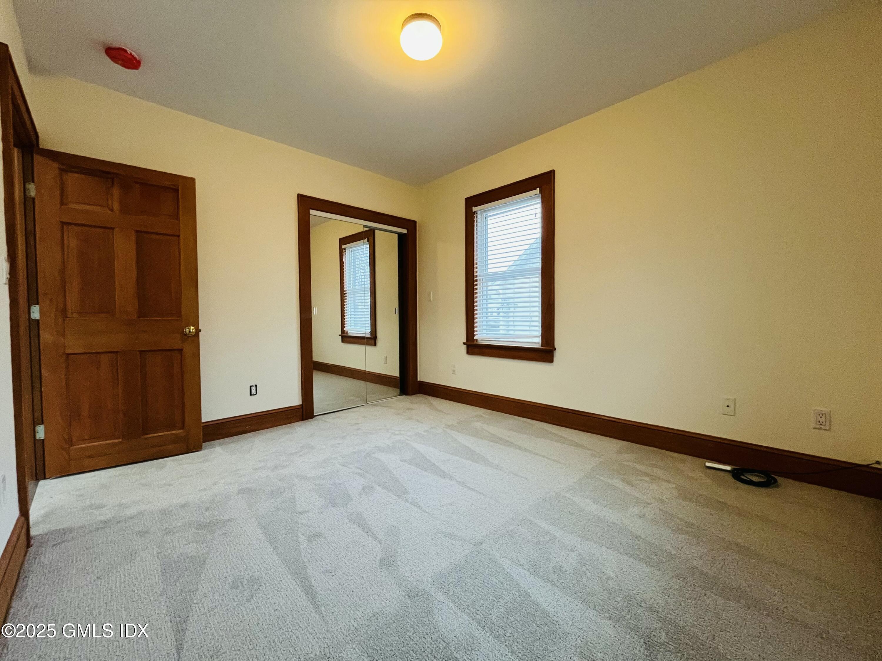18 Grand Street, Unit 2 Greenwich, CT 06830 - Photo 8 of 10 a view of an empty room with a window