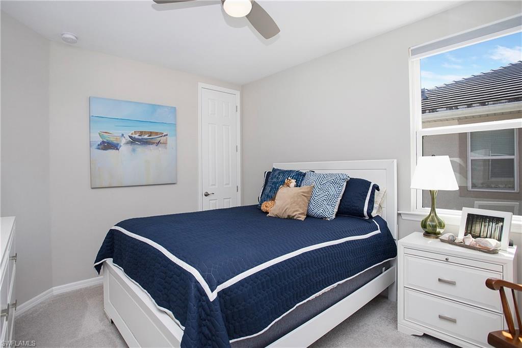 14899 Edgewater Circle Naples, FL 34114 - Photo 13 of 33 a bed room with a bed and window