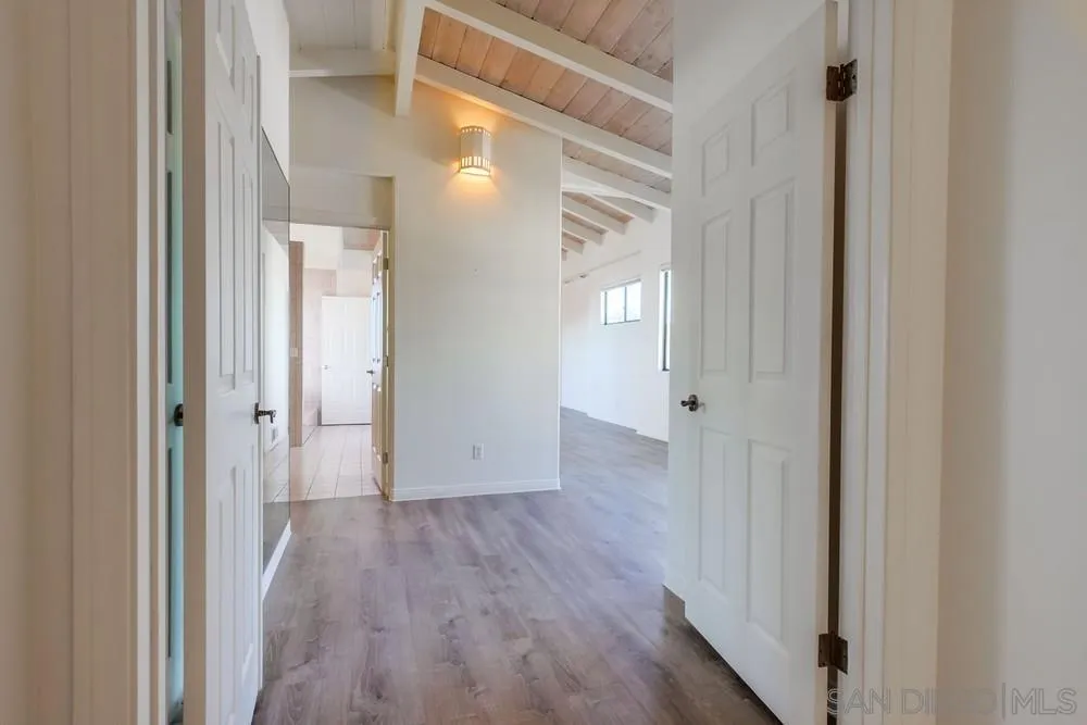 1145 La Jolla Rancho Road La Jolla, CA 92037 - Photo 18 of 45 a view of a hallway with wooden floor
