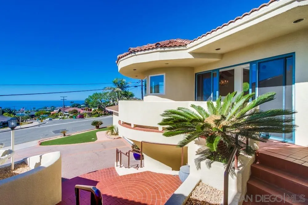 1145 La Jolla Rancho Road La Jolla, CA 92037 - Photo 2 of 45 a view of a patio with table and chairs potted plants