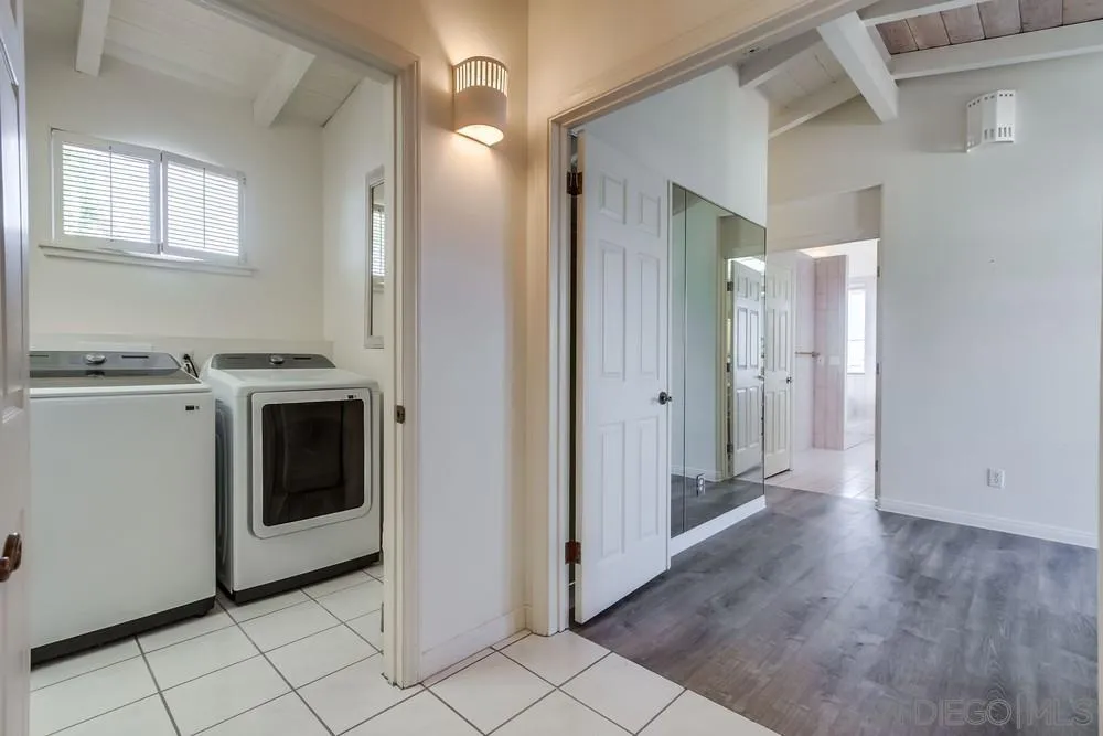 1145 La Jolla Rancho Road La Jolla, CA 92037 - Photo 25 of 45 a view of a kitchen with a stove cabinets and a wooden floor