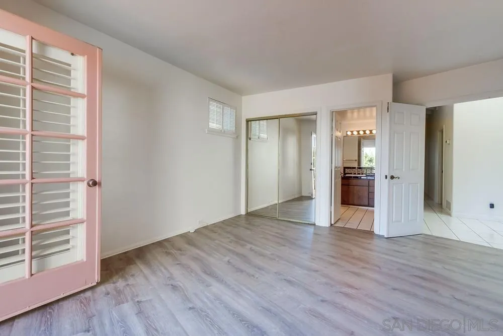 1145 La Jolla Rancho Road La Jolla, CA 92037 - Photo 29 of 45 a view of empty room with wooden floor