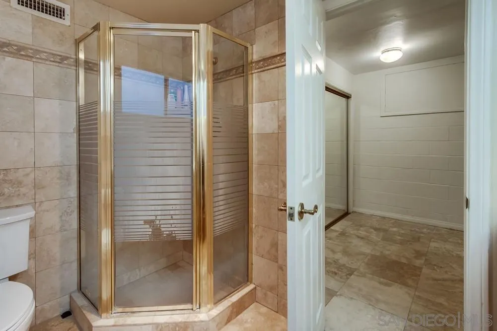 1145 La Jolla Rancho Road La Jolla, CA 92037 - Photo 36 of 45 a bathroom with a shower and a glass door