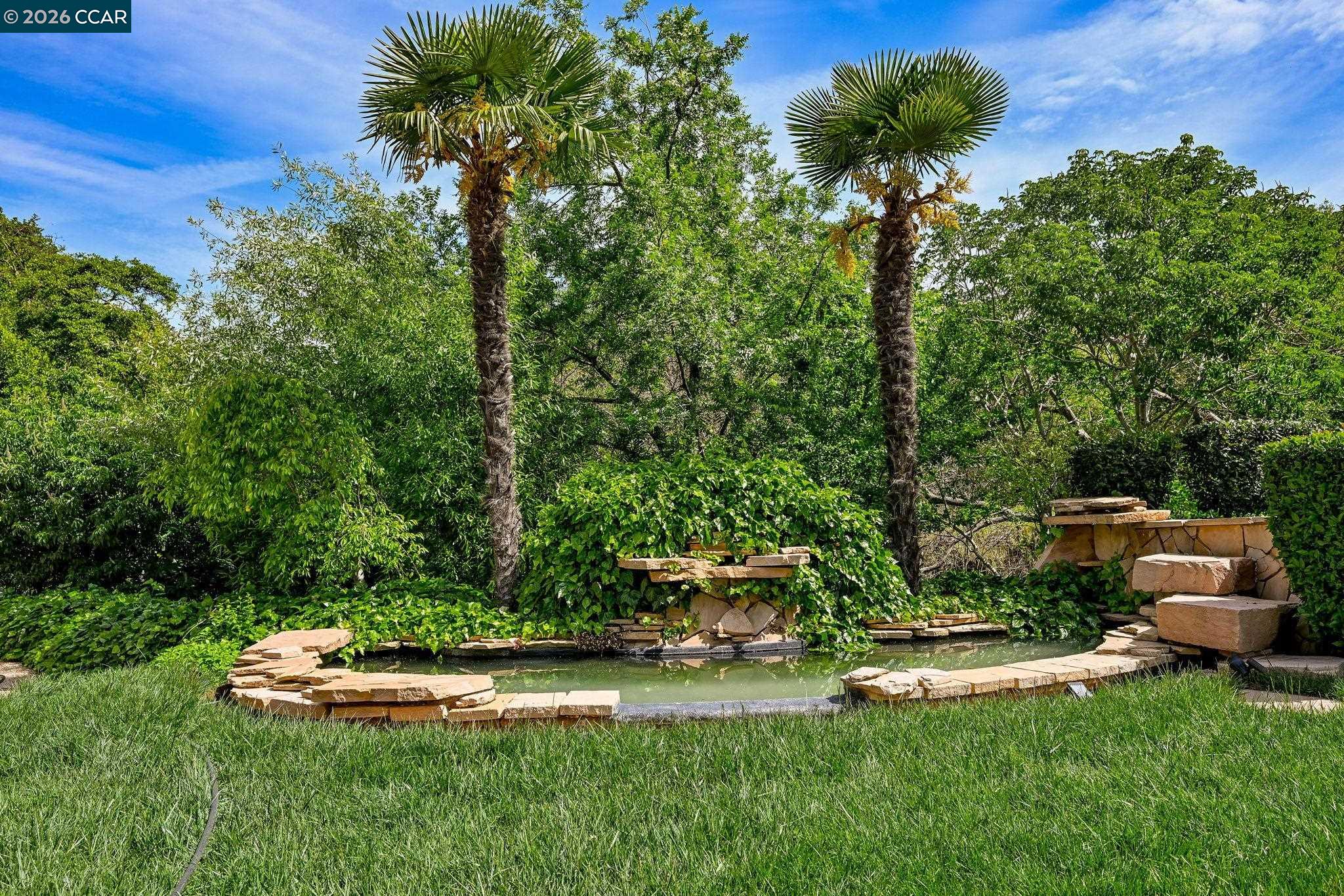 490 St Marys Road Lafayette, CA 94549 - Photo 35 of 61 a view of a garden with lawn chairs
