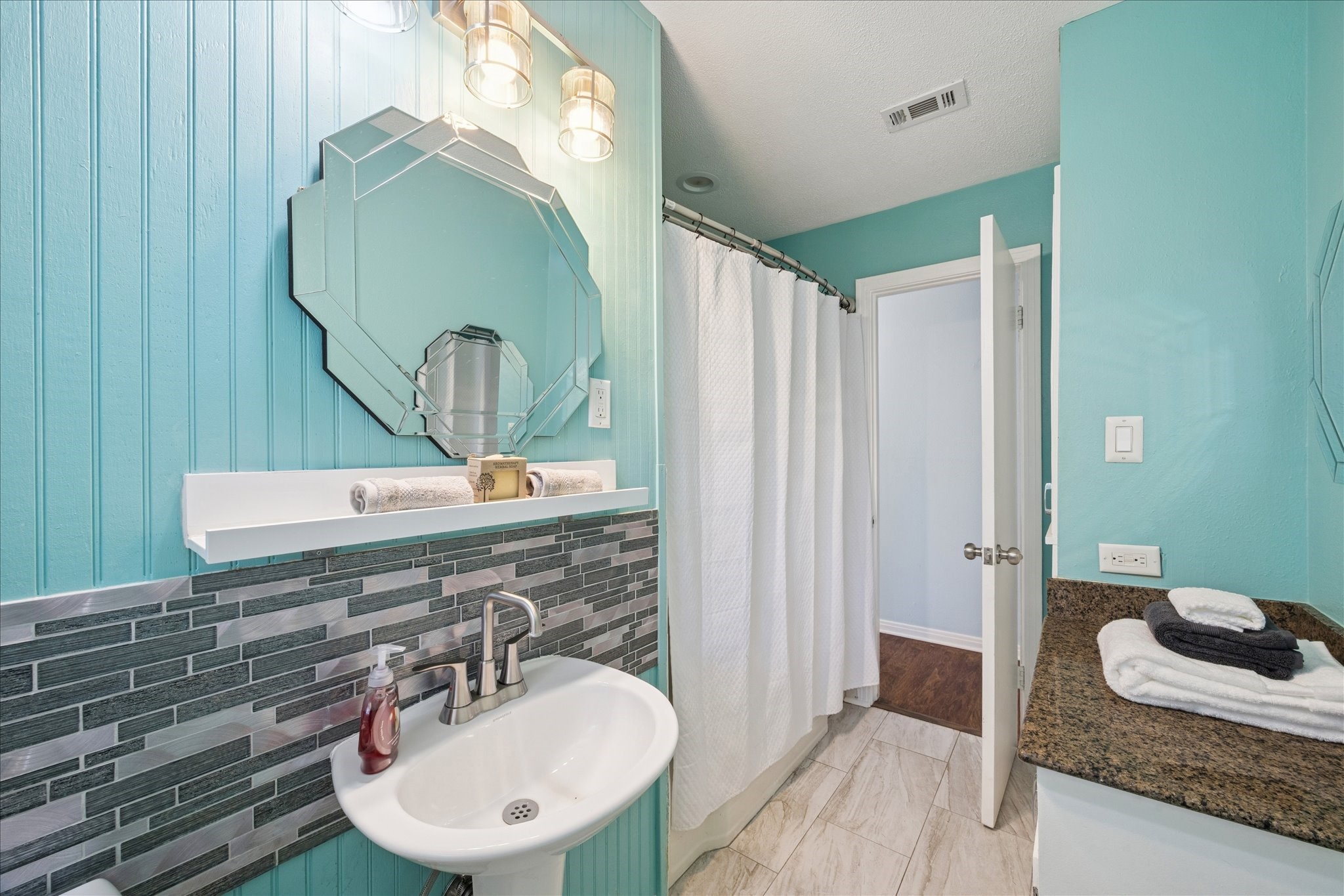 329 Robin Street Deer Park, TX 77536 - Photo 19 of 30 a bathroom with a sink and a mirror