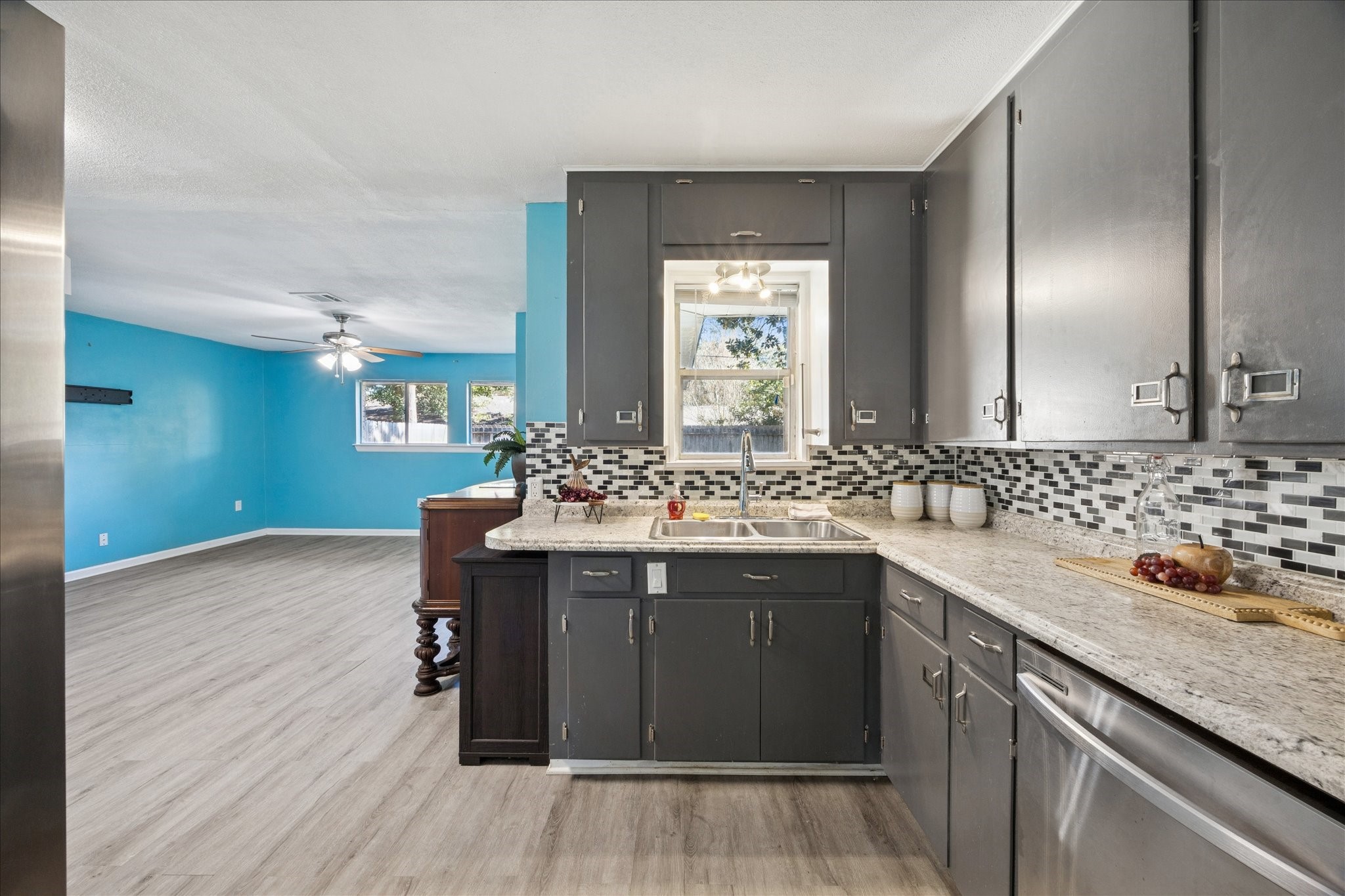 329 Robin Street Deer Park, TX 77536 - Photo 3 of 30 a kitchen with a sink and cabinets