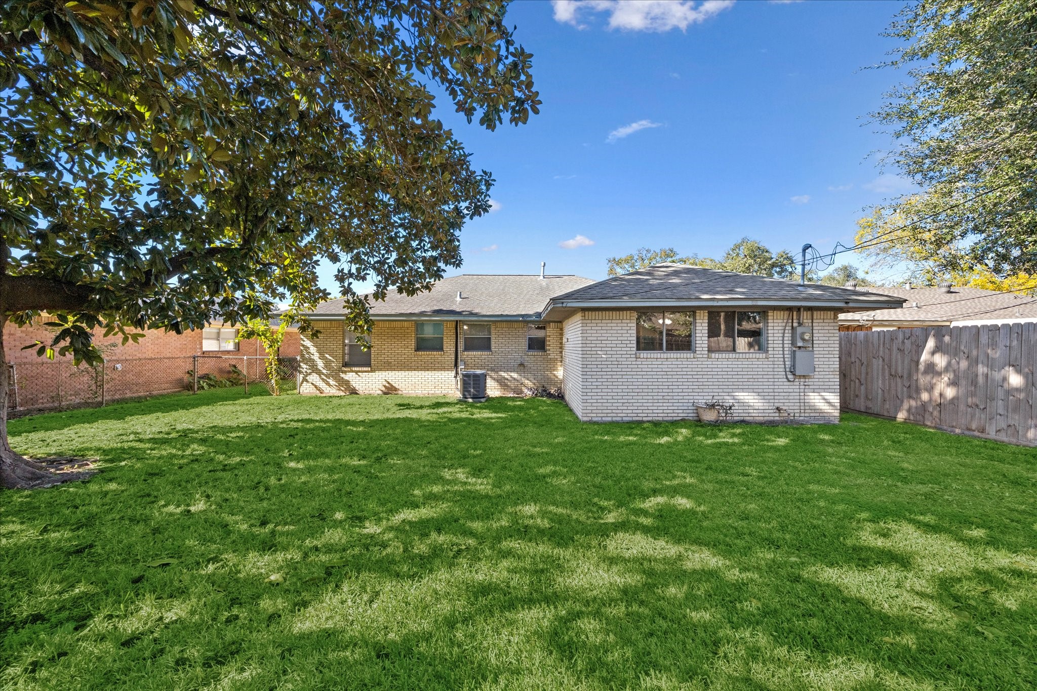 329 Robin Street Deer Park, TX 77536 - Photo 5 of 30 a view of a house with a backyard