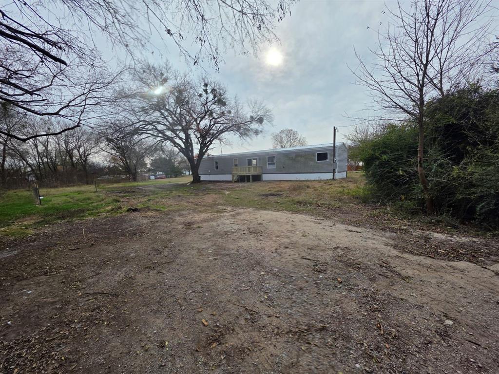 1201 South Patterson Campbell, TX 75422 - Photo 5 of 7 a view of a big yard with large trees