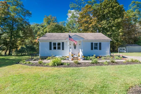 a house with garden in front of it