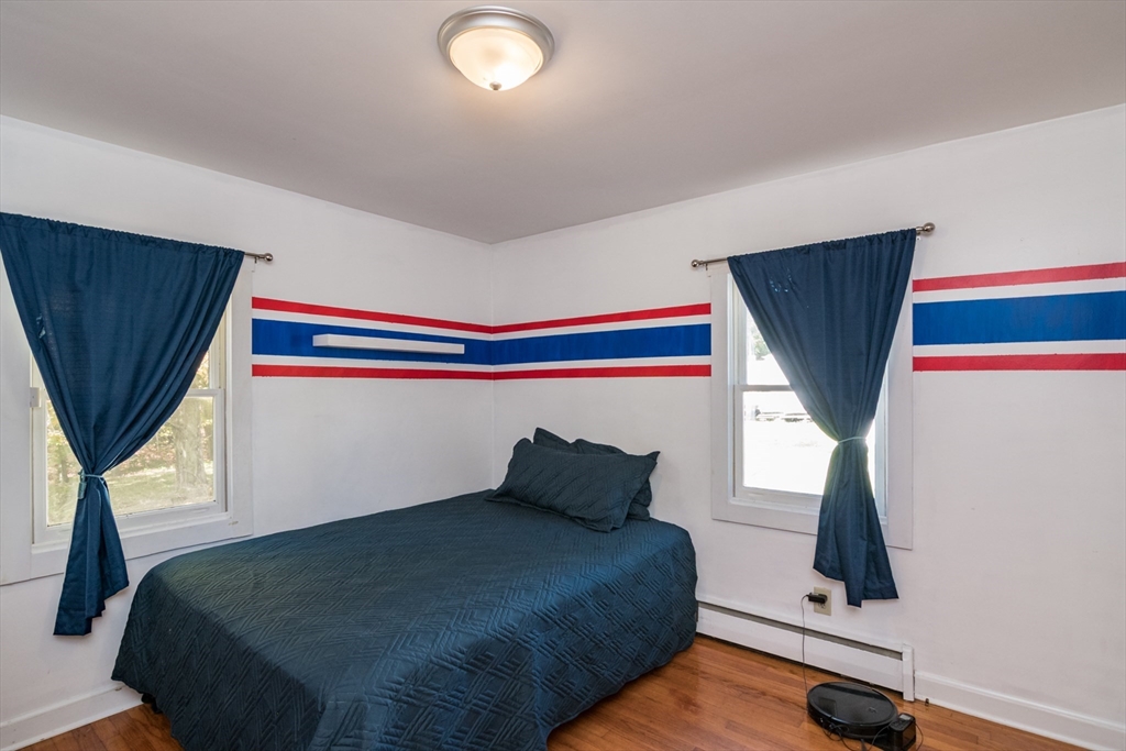 82 Comins Pond Road Warren, MA 01083 - Photo 11 of 18 a bedroom with a bed and window