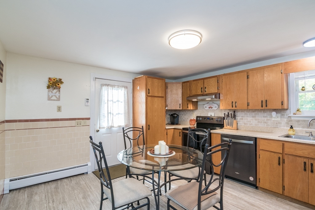 82 Comins Pond Road Warren, MA 01083 - Photo 12 of 18 a view of a dining room with furniture and wooden floor